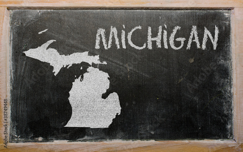 Photo: outline map of us state of michigan on blackboard outline map of us state of michigan on blackboard
