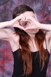 heart with human hands of y young woman