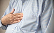 Foto: businessman with heartburn pain businessman with heartburn pain