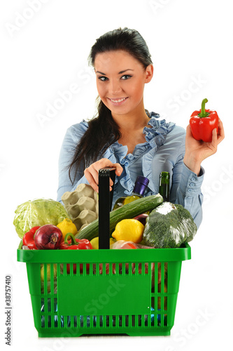 Photo: Young woman with shopping basket isolated on white Young woman with shopping basket isolated on white