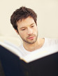 Serious Scholar With Large Teaxtbook
