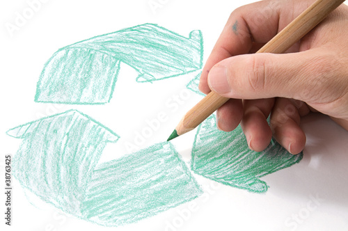 Photo: Male hand drawing recycle sign on white background. Male hand drawing recycle sign on white background.