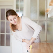 Young woman doing housework, cleaning the kitchen