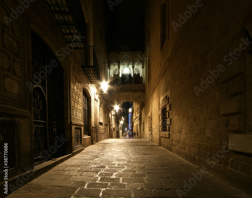 Photo: Gothic quarter at night. Empty alleyways in Barcelona Gothic quarter at night. Empty alleyways in Barcelona