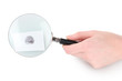 Magnifying glass in hand and fingerprint isolated on white
