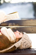 Photo: Woman reading book outdoors at winter time Woman reading book outdoors at winter time