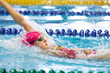 Photo: Young girl floating on her back in the pool Young girl floating on her back in the pool