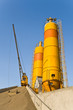 Yellow concrete silos over blue sky