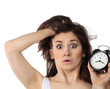 Surprised woman holding clock Surprised woman holding clock