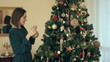 Woman decorating Christmas tree
