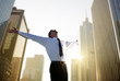 happy young businessman and big city