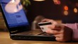 HD dolly: a girl using credit card on-line