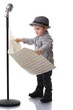 Baby boy reading music notes.