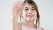 happy child waving good-bye and blowing kisses