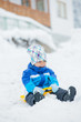The boy goes for a drive on an snow slope. The boy goes for a drive on an snow slope.
