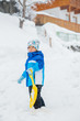 The boy goes for a drive on an snow slope. The boy goes for a drive on an snow slope.