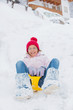 The girl goes for a drive on an snow slope. The girl goes for a drive on an snow slope.