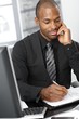 Businessman writing notes