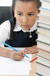 African American School Girl Writing In Class