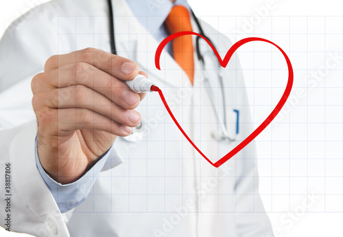 Photo: Male doctor drawing heart symbol at the whiteboard Male doctor drawing heart symbol at the whiteboard