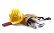 isolated hard hat with tools and blueprint on white