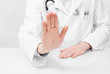 Doctor with stethoscope at the desk