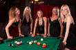 Group of happy girls playing in billiard