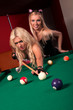 Happy girls playing in billiard