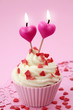Cup cake with heart candles