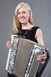 Beautiful young woman with an accordion.