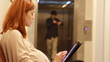 girl in pregnent in the firm with tablet