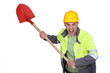 Angry construction worker holding spade