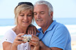 Mature couple looking at the photos on their digital camera