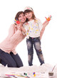 mother and her little daughter with color paint