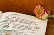Poesiealbum mit getrockneter Rose