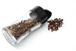 Black pepper and pepper bottle on white background Black pepper and pepper bottle on white background