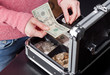 Woman making change from a cash box