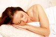 Foto: young woman sleeping on sofa young woman sleeping on sofa