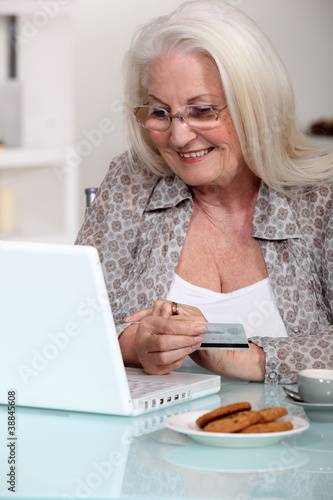 Photo: senior lady shopping on the internet senior lady shopping on the internet