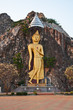 gold image of buddha on cliff gold image of buddha on cliff