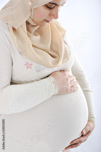 Photo: Arabic Muslim pregnant woman wearing traditional clothes Arabic Muslim pregnant woman wearing traditional clothes