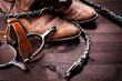 Cowboy boots,whip and spurs on wood