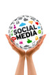 Hands holding a Social Media Sphere
