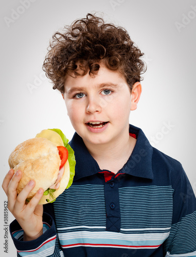 Photo: Boy eating big sandwich Boy eating big sandwich