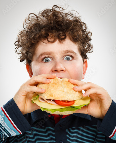 Photo: Boy eating big sandwich Boy eating big sandwich