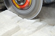 Grinder Cutting Concrete Block