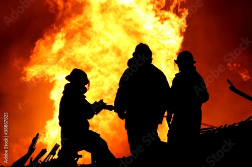Photo: Three fire fighters and huge flames Three fire fighters and huge flames
