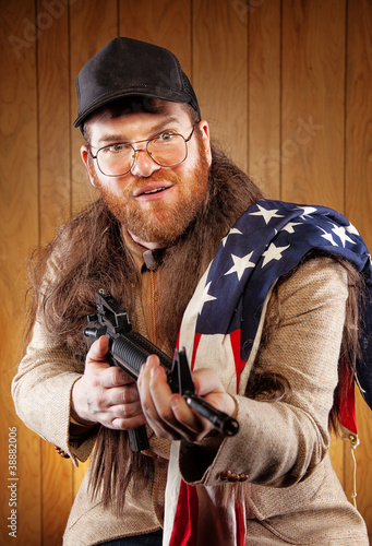 Photo: American White Trash Holding Gun Wearing Flag American White Trash Holding Gun Wearing Flag
