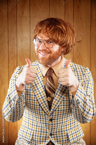 Photo: Happy Nerdy 60s Game Show Host Giving 2 Thumbs Up Happy Nerdy 60s Game Show Host Giving 2 Thumbs Up