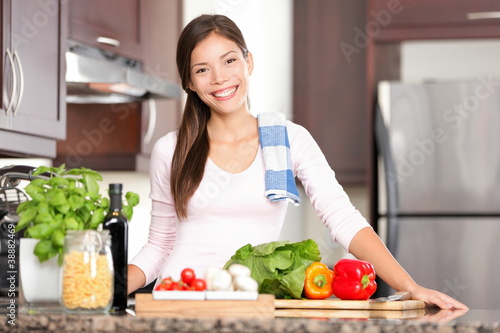 Photo: Kitchen woman making food Kitchen woman making food